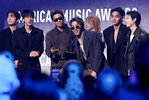How did K-pop collect 11 titles at AMAs?