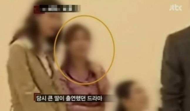 This screenshot of local broadcaster JTBC's coverage of the 2004 gang-rape of an actress shows the victim (center) appearing on a TV show. (JTBC)