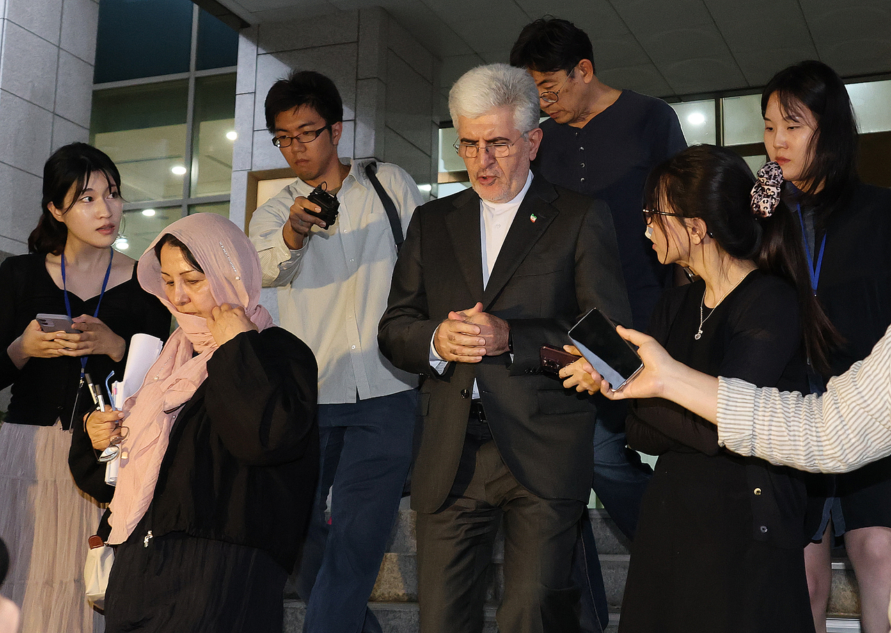 Iranian Ambassador to South Korea Saeed Koozechi (center) leaves the foreign ministry building in Seoul on May 27, 2026, after the ministry called him in over an attack against a South Korean vessel in the Strait of Hormuz. (Yonhap)