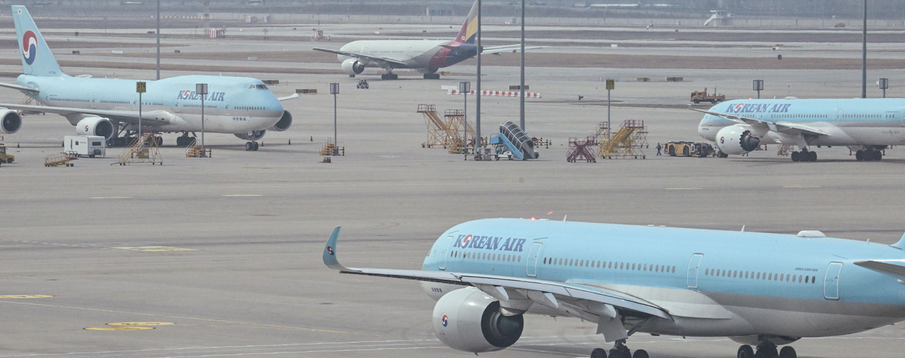 Aircraft are seen parked at Incheon Airport Terminal 2 on April 1. (Im Se-jun/The Korea Herald)
