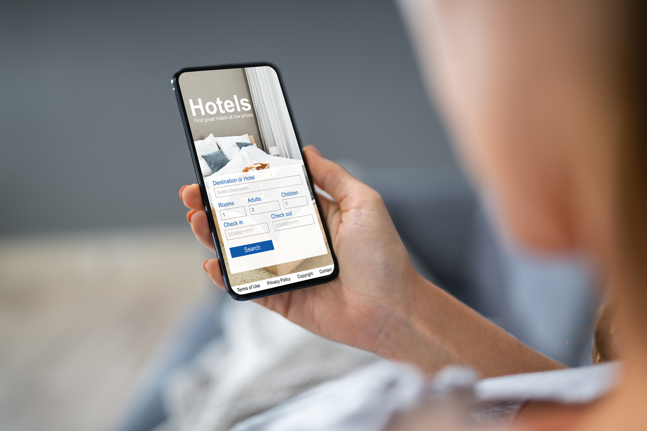 Close-up of a person searching for hotels through an app (Getty Image)