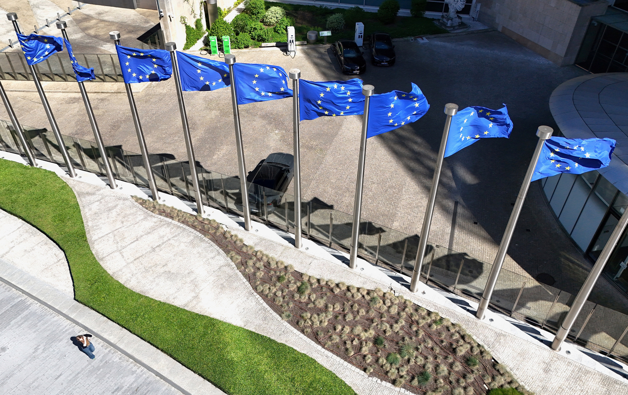 A drone view shows the European Union flags outside the European Commission headquarters, known as the Berlaymont building in Brussels, in April. (Reuters-Yonhap)