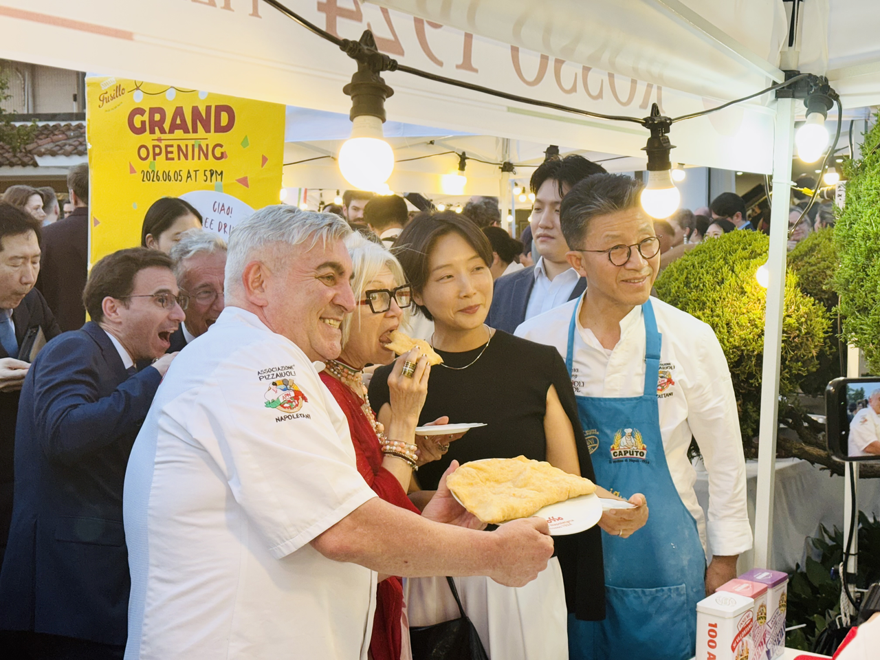 South Korea's  Deputy Foreign Minister Chung Eui-hae (second from right) and Italian Ambassador to Korea Emilia Gatto (second from left) pose with chefs after tasting Italian cuisine during Italy's Republic Day reception in Seoul on Tuesday. (Sanjay Kumar/The Korea Herald)