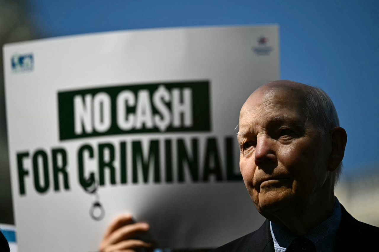 Former US Commissioner of Internal Revenue Service John Koskinen speaks during an event protesting US President Donald Trump's IRS settlement in Washington, Tuesday. (AFP-Yonhap)