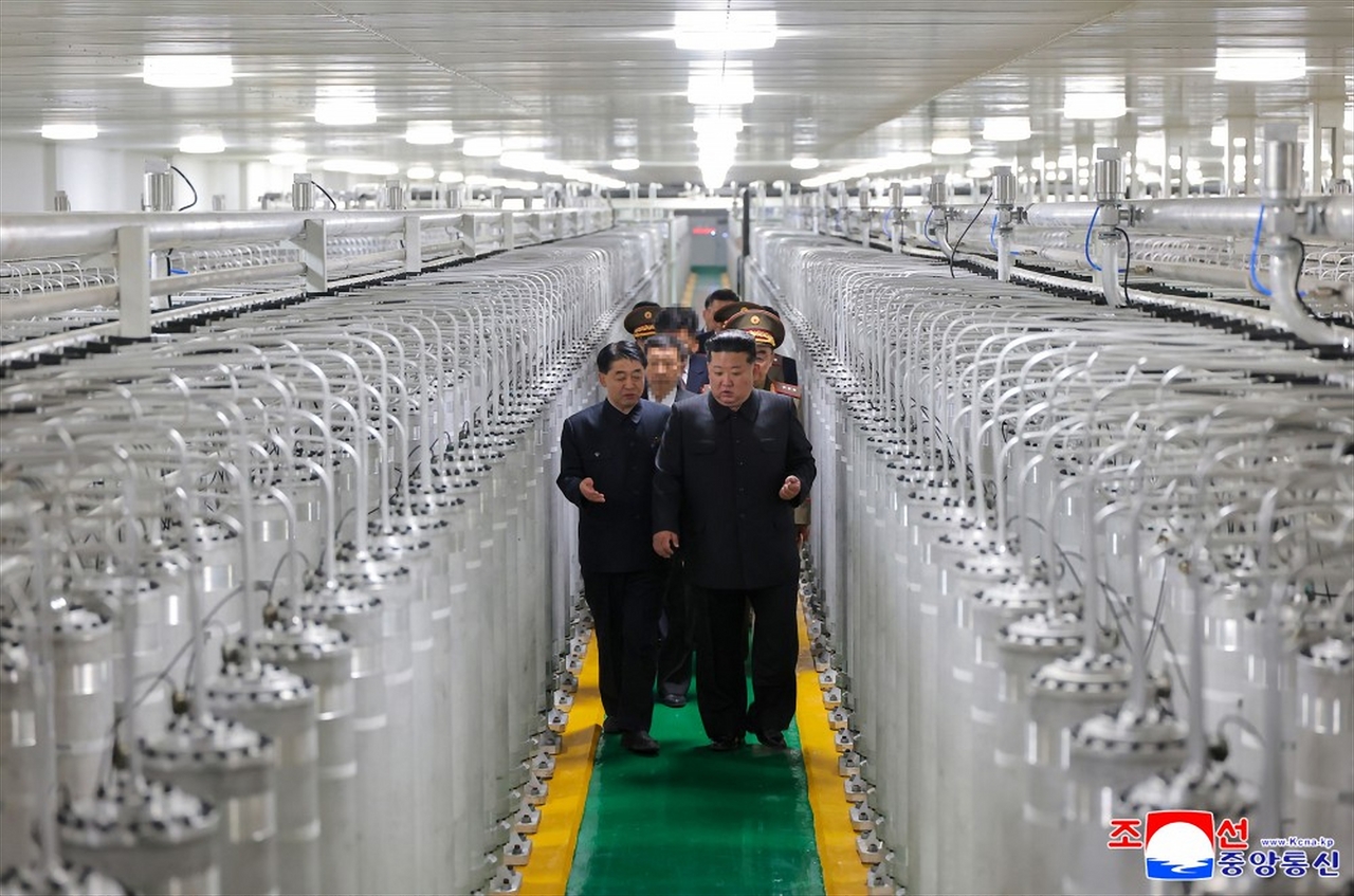 North Korean leader Kim Jong-un inspects a newly operational nuclear materials production facility in this photo taken from the Korean Central News Agency’s website on June 4. (Yonhap)