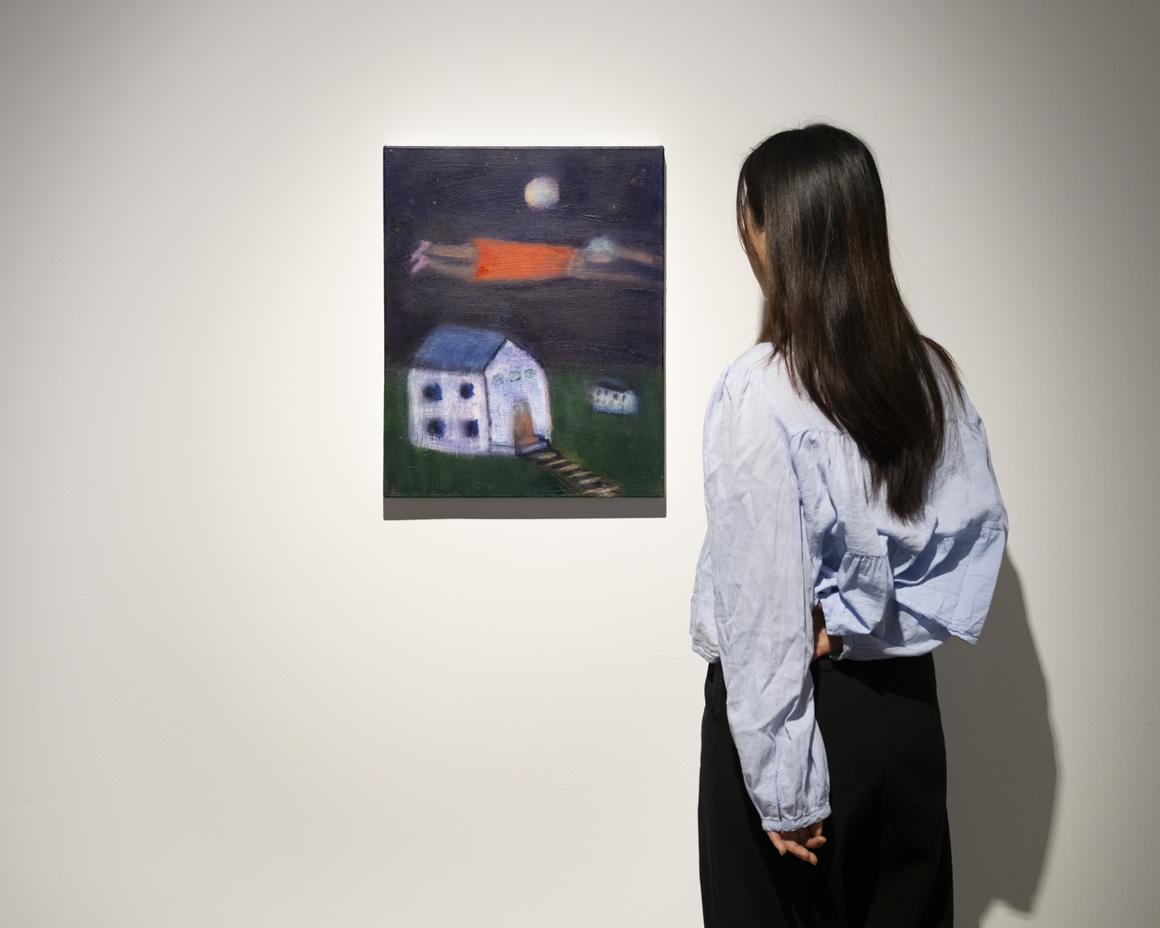 A visitor views a work on display at "Living a Dream" at Gallery Hyundai in Seoul. (Gallery Hyundai)