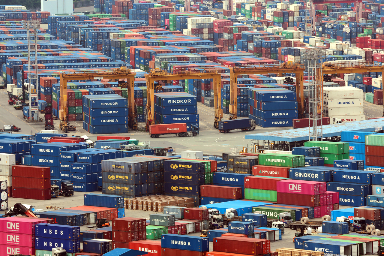 Containers are stacked at a port in the city of Busan on Monday. (Yonhap)