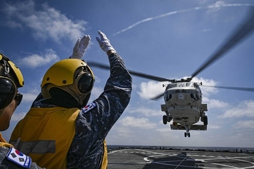 South Korean Navy officers participate in a joint maritime search and rescue exercise with Japan's Maritime Self-Defense Force in international waters southeast of Jeju Island on Sunday. (Republic of Korea Navy)