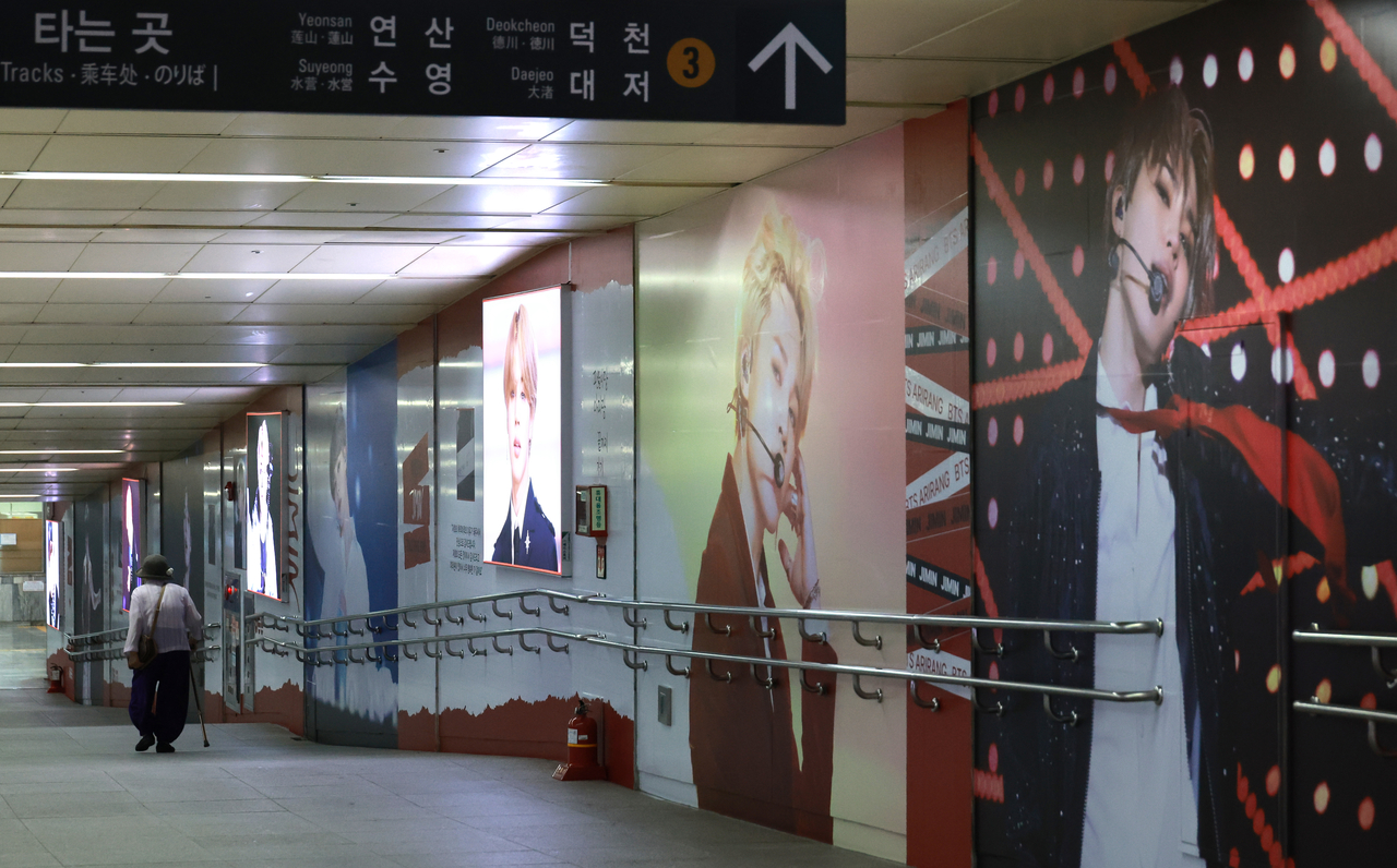 Photos of BTS member Jimin cover a wall at Sports Complex Station in Busan on Monday ahead of the group's concert this weekend. (Yonhap)