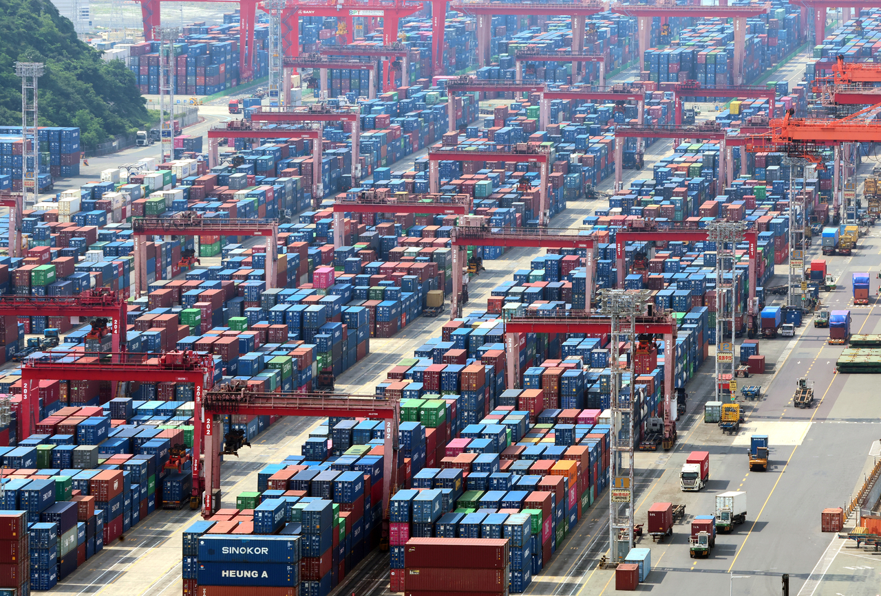 Containers are stacked at a port in the southeastern port city of Busan, in this file photo from June 1, 2026. (Yonhap)