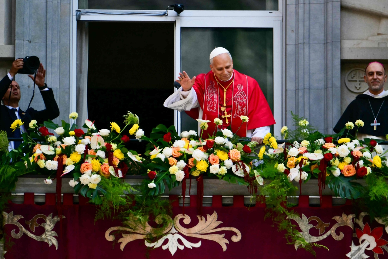 Pope Leo XIV waves to faithful from a balcony after the recitation of the Rosary at the Abbey of Our Lady of Montserrat, near Barcelona, on June 10, 2026. Pope Leo XIV is visiting Spain June 6-12 with stops in Madrid, Barcelona, and the Canary Islands, where he will meet with migrants and organisations dedicated to helping them. (Stefano Rellandini/AFP)