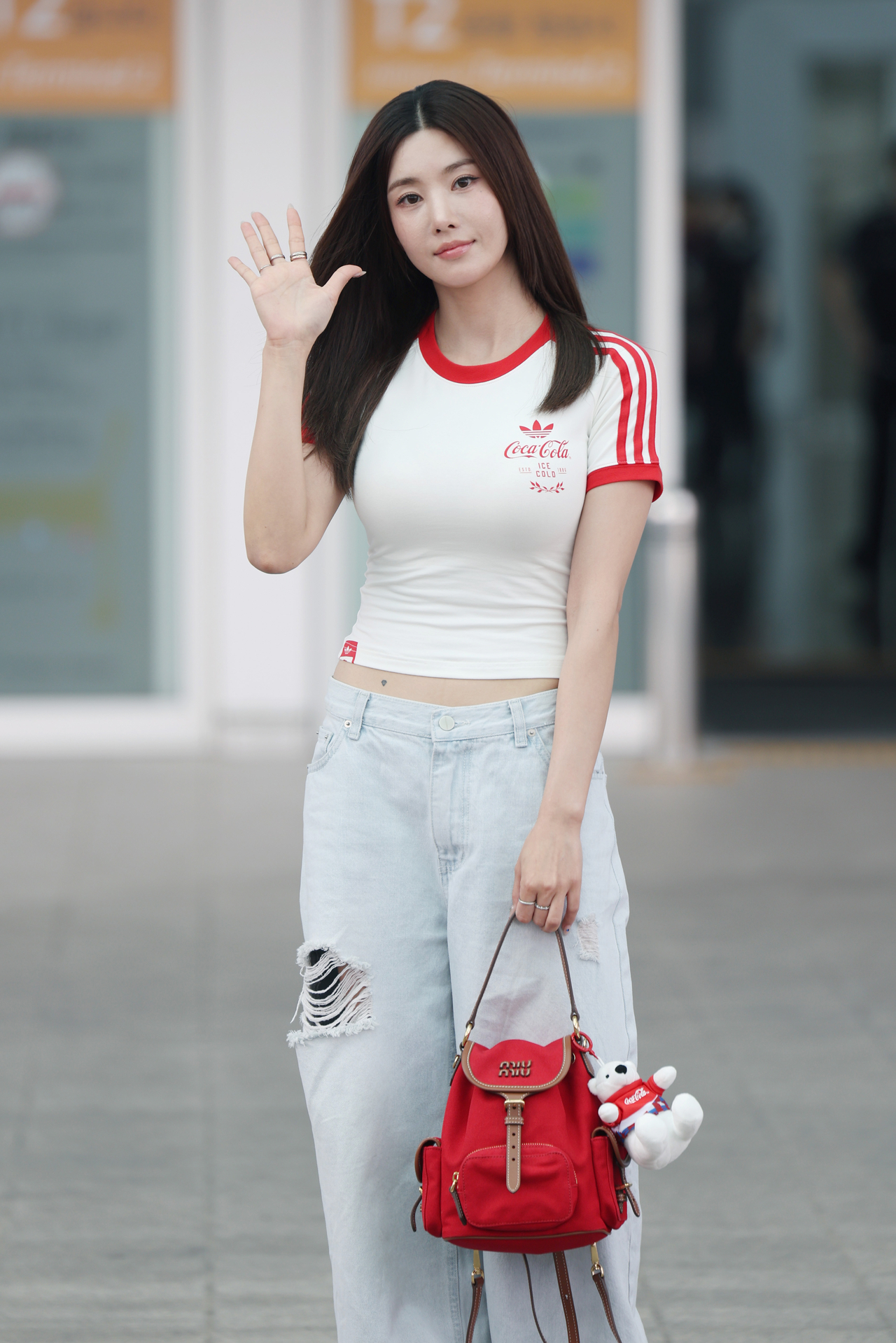 Kwon Eun-bi poses for photos at Incheon Airport on Wednesday before departing for Mexico to support the Korean national football team at the 2026 FIFA World Cup. (Newsis)
