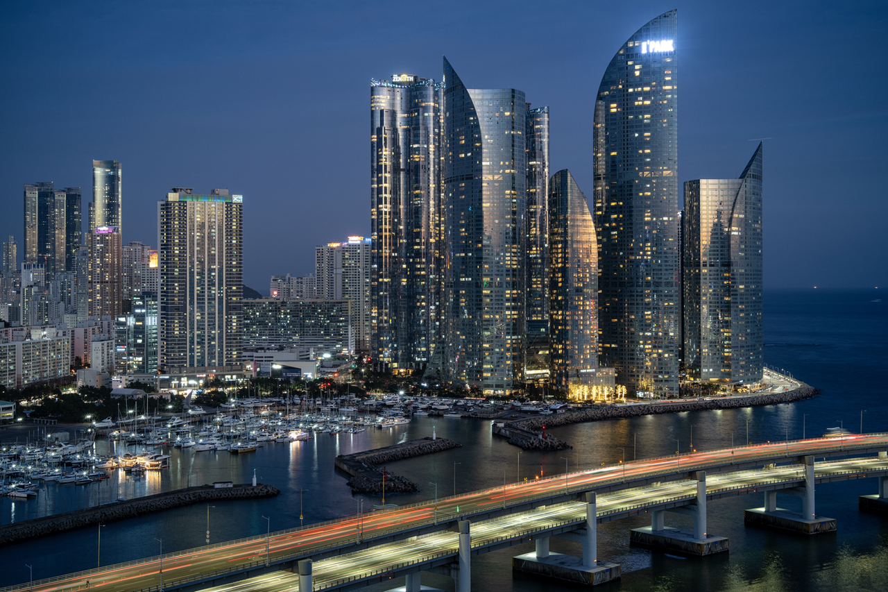 Marine City skyscrapers rising along the Haeundae waterfront at dusk in Busan