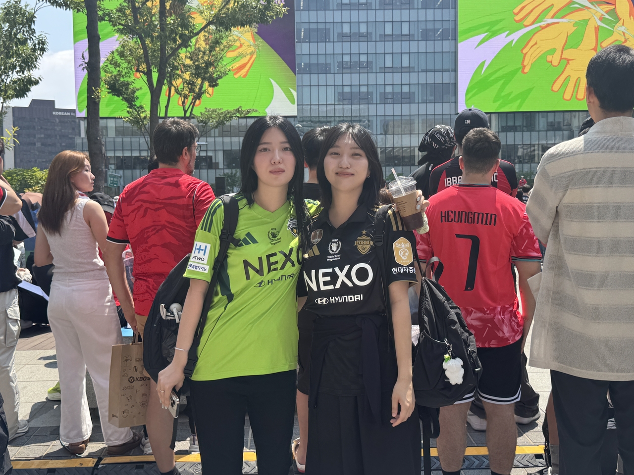 Kim Ha-eun and Kim Ha-young sisters traveled from Jeonju and joined Gwanghwamun Square to root for Team Korea in 2026 World Cup. (Cha Min-jung/The Korea Herald)