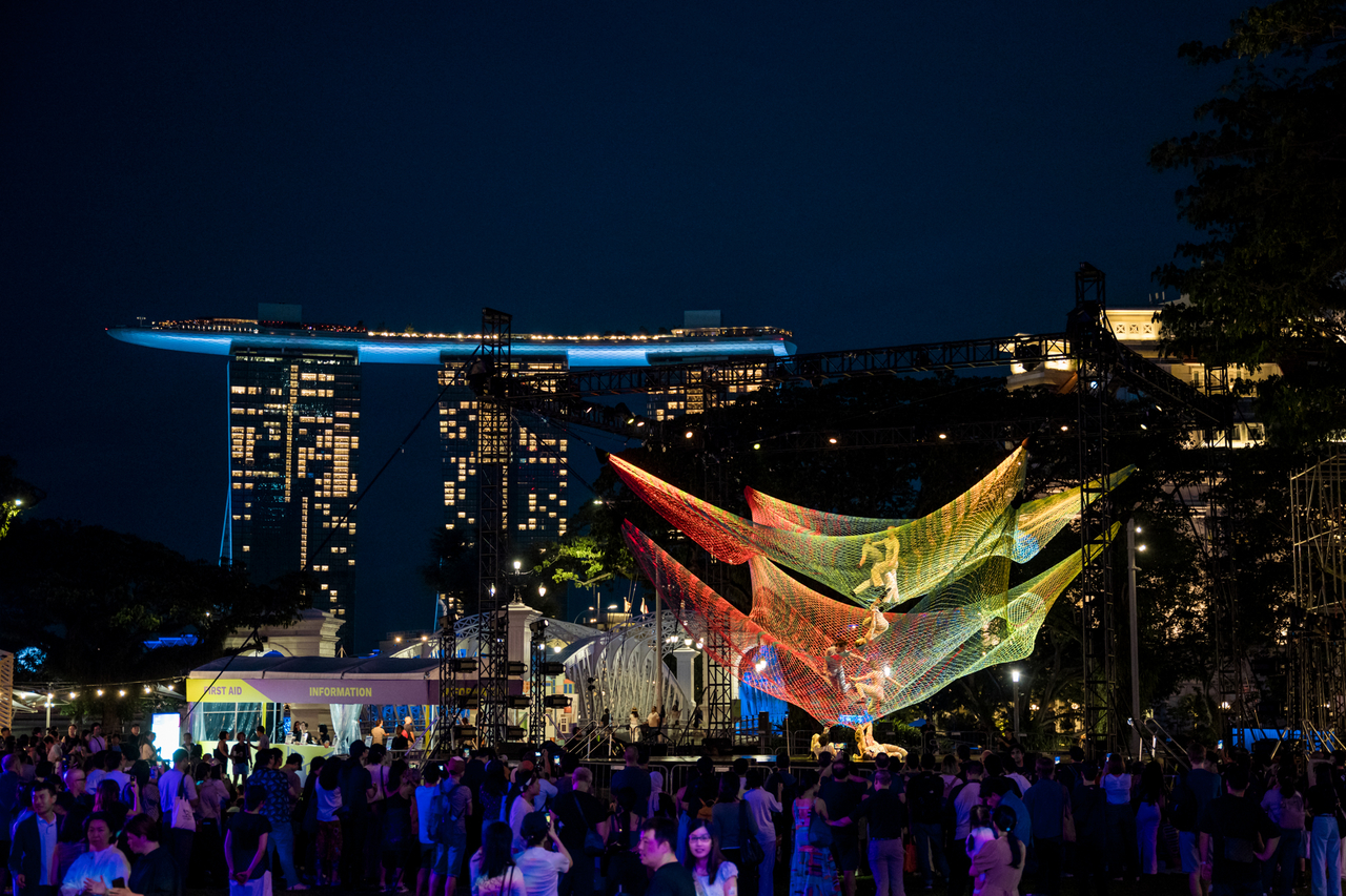 Crowds watch "Noli Timere," an aerial performance, at Singapore International Festival of Arts 2026 in Singapore, May 15. (Arts House Group)