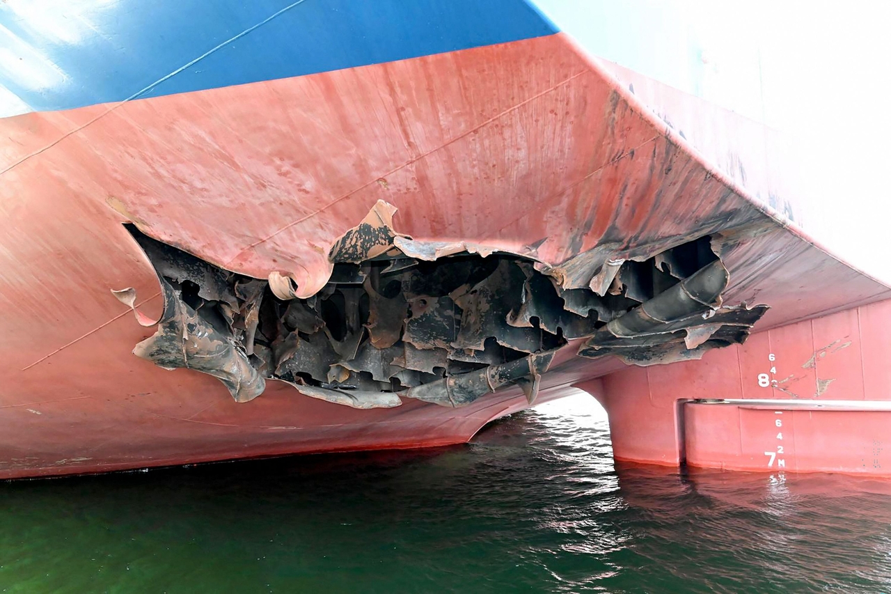 This undated handout photograph released by South Korea's Foreign Ministry on May 10, 2026, shows a damaged part of the South Korean cargo ship HMM Namu docked at a port in Dubai.  (AFP-Yonhap)