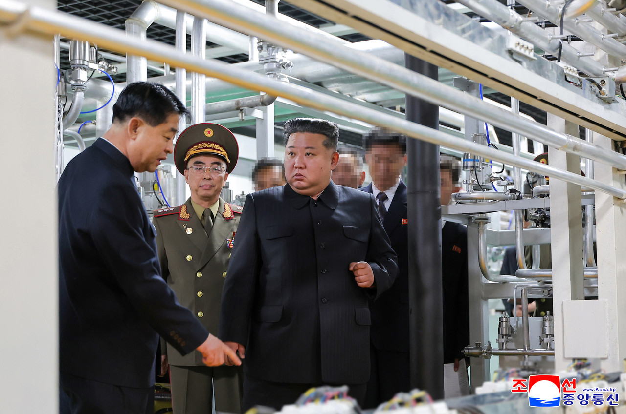 North Korean leader Kim Jong-un inspects a newly operational nuclear materials production facility in this photo taken from the Korean Central News Agency’s website on June 4. (Yonhap)
