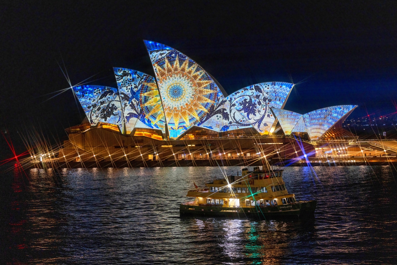 A passing vessel becomes a supporting player as the Opera Mundi mapping show unfolds.