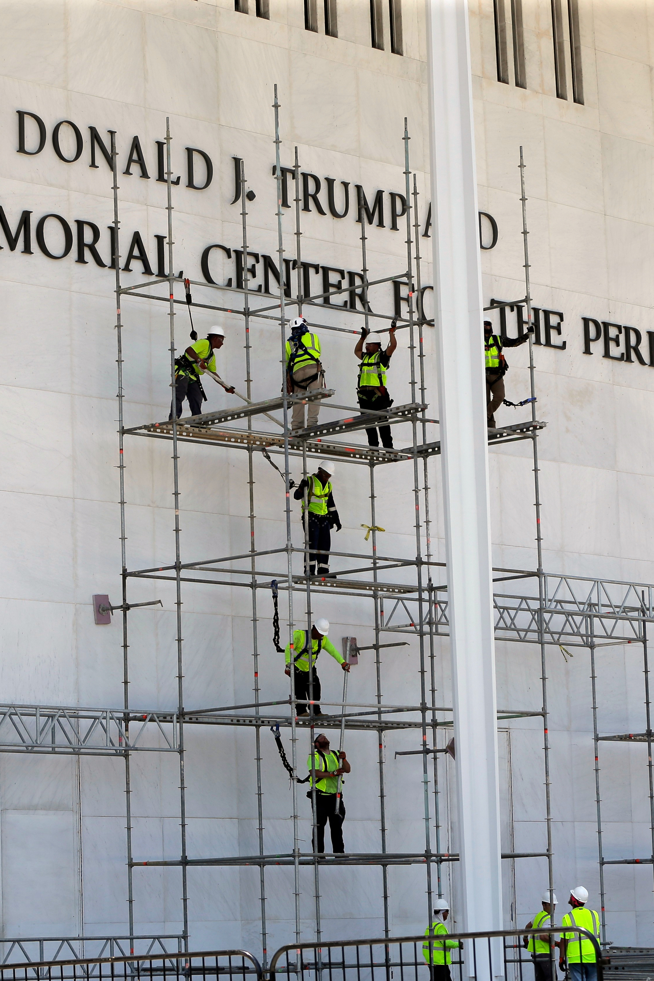 President Donald Trump's name appears behind scafforlding at the sign for the John F. Kennedy Center for the Performing Arts  in Washington on Friday.   AP-Yonhap