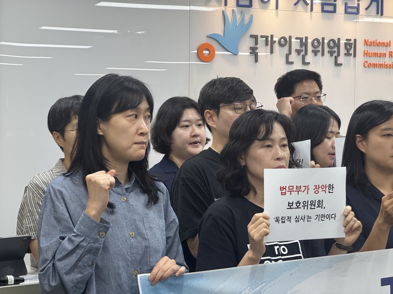 Lawyers and activists call for better treatment of detained foreign nationals and reform to the Foreigners Protection Committee during a press conference held at the National Human Rights Commission of Korea headquarters on Tuesday. (Lee Seung-ku/The Korea Herald)