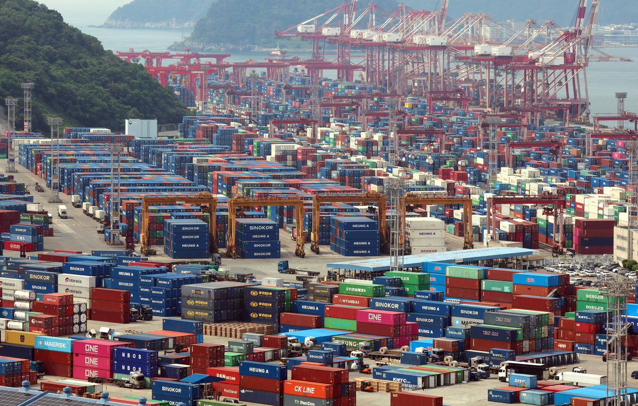 Containers are stacked at a port in the southeastern city of Busan, in this file photo from June 1. (Yonhap)