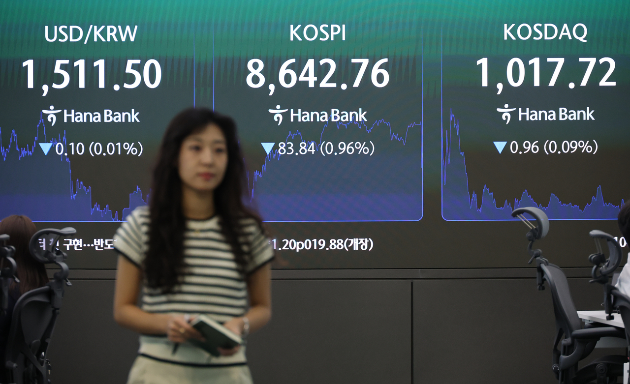 Financial data is shown on screens inside the dealing room of Hana Bank in central Seoul, on Wednesday. (Yonhap)