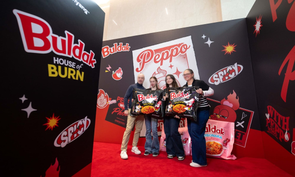 Visitors pose for photos at a Buldak pop-up store at Samyang Foods' headquarters in Seoul in March. (Samyang Foods)