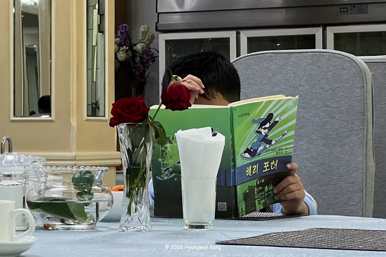 A North Korean boy in Pyongyang reads a Korean language version of the Harry Potter book in Pyongyang, DPRK on April 21, 2026. (Hyungwon Kang)