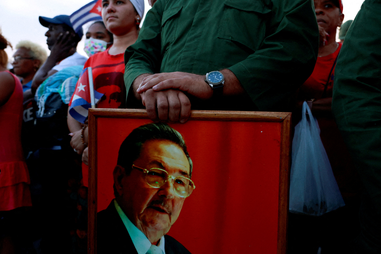 A person holds a picture of former Cuban president Raul Castro in Havana in May. (Reuters-Yonhap)