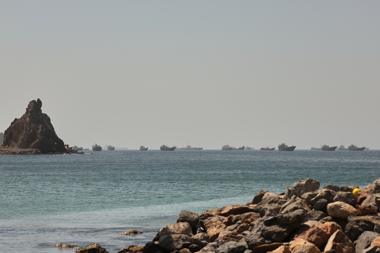 Tankers and cargo vessels are seen in the Gulf of Oman, along shipping routes linking the Strait of Hormuz and the Arabian Sea, Tuesday. (AP-Yonhap)