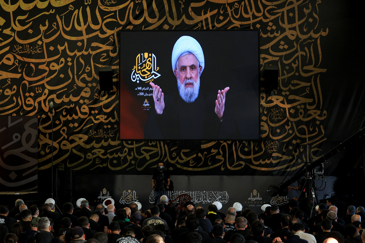 People watch Hezbollah chief Naim Qassem deliver a televised speech on a giant screen at the burial site of former Hezbollah leader Hassan Nasrallah, on the outskirts of Beirut, Lebanon, on June 17, 2026. (Reuters-Yonhap)