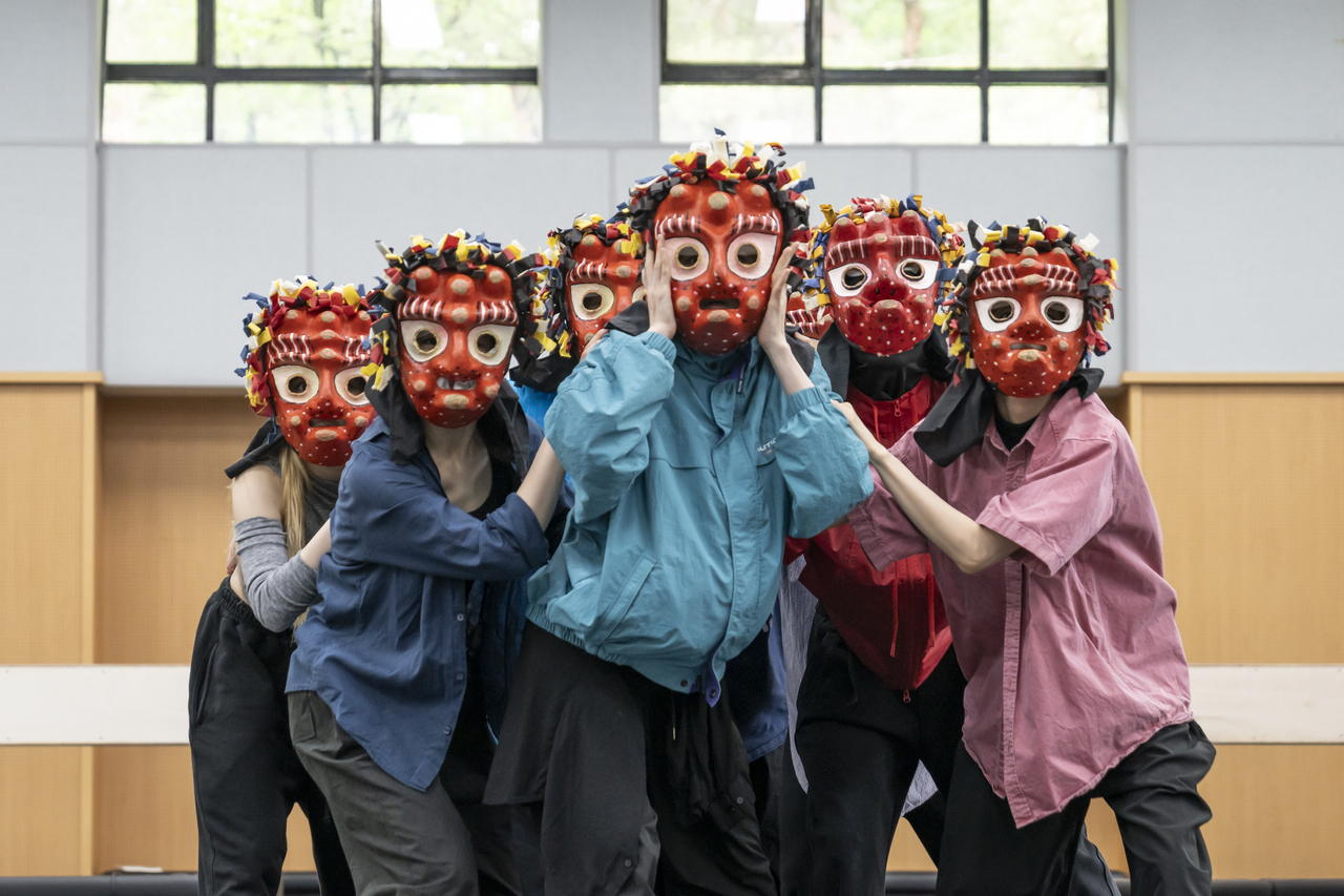 Joseon-Era Street Dance Receives a Modern Twist 13 Dancers of the National Dance Company of Korea rehearse a scene from “Mask Off.” (National Dance Company of Korea)