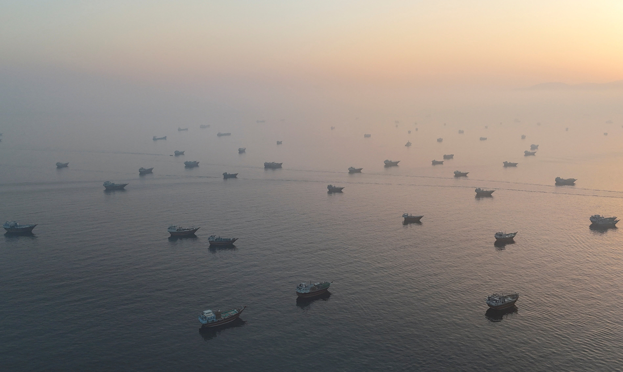 Ships navigate the Strait of Hormuz as seen from a drone over Musandam, Oman, on June 15. [Reuters]