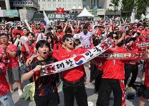 From public squares to pubs, Korea cheers as one