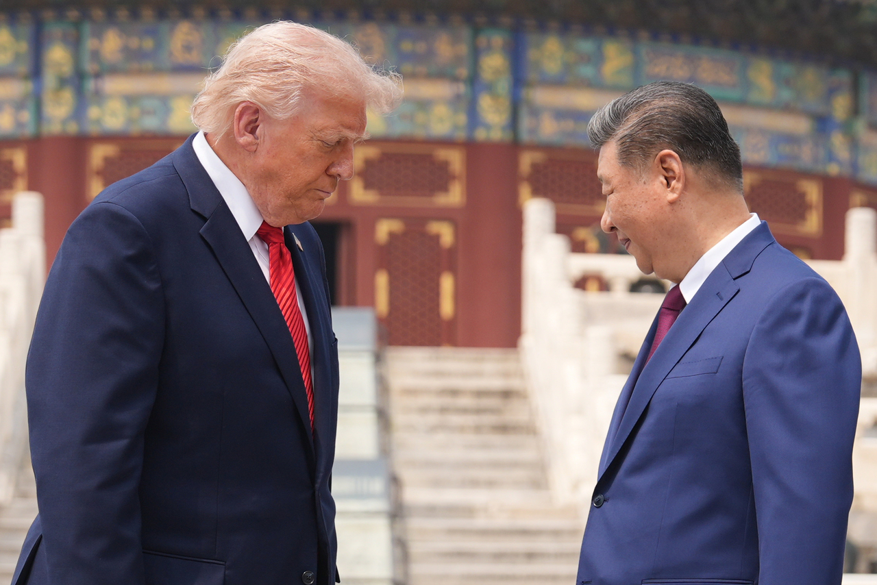 US President Donald Trump (left) stands beside Chinese President Xi Jinping at the Temple of Heaven on Thursday in Beijing. (AP)