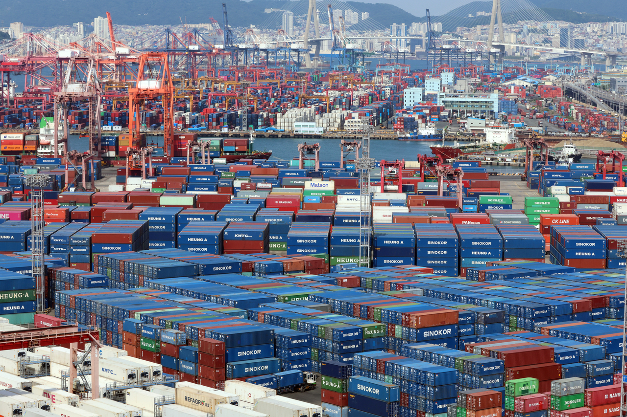 Containers are stacked at a port in the southeastern city of Busan in this photo taken Tuesday. (Yonhap)