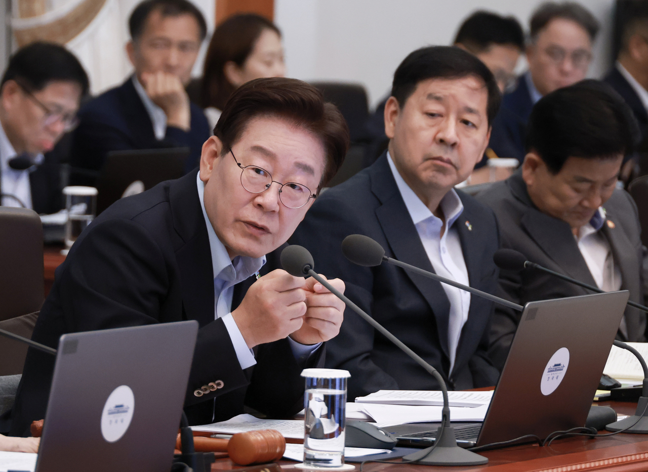 President Lee Jae Myung speaks during a Cabinet meeting and emergency economic review session held at Cheong Wa Dae in Seoul on Tuesday. (Yonhap)