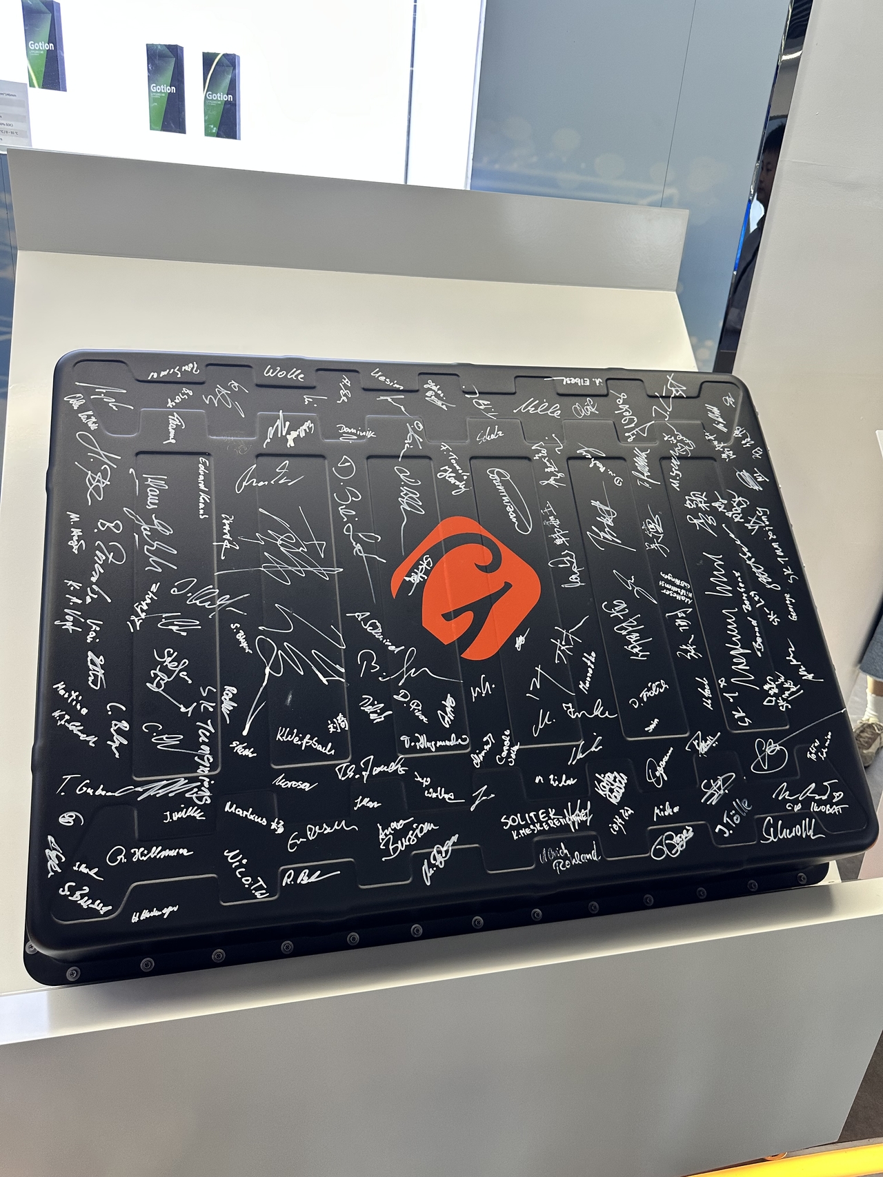 A commemorative battery pack displayed at Gotion High-Tech’s headquarters in Hefei, Anhui Province, on June 11 bears signatures from Gotion and Volkswagen employees and executives, and other officials, marking the production of the company’s first Germany-made battery pack at its Gottingen factory in 2023. (Byun Hye-jin/The Korea Herald)