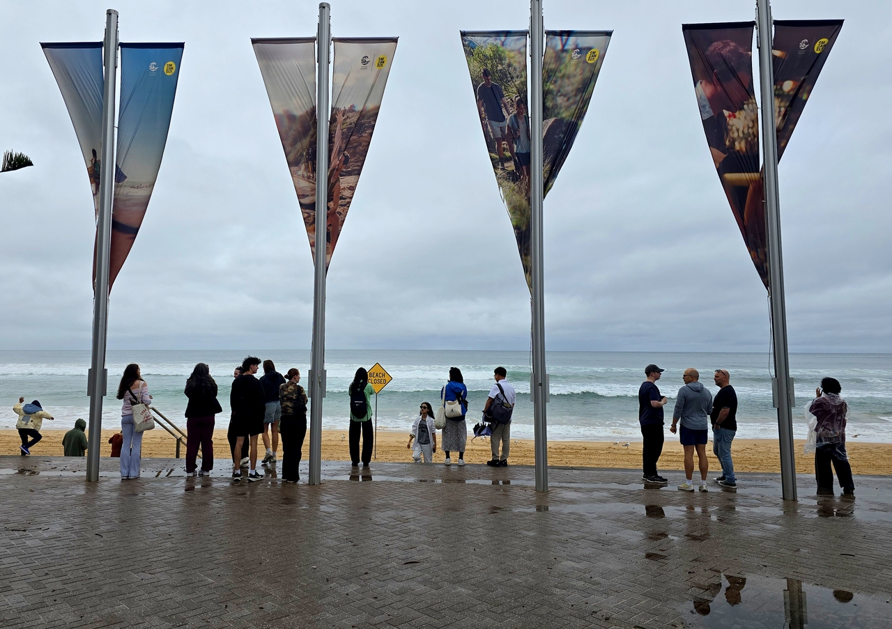 The entrance to Manly Beach on a rainy day. Watching expert surfers ride the waves is a thrill even from the shore.