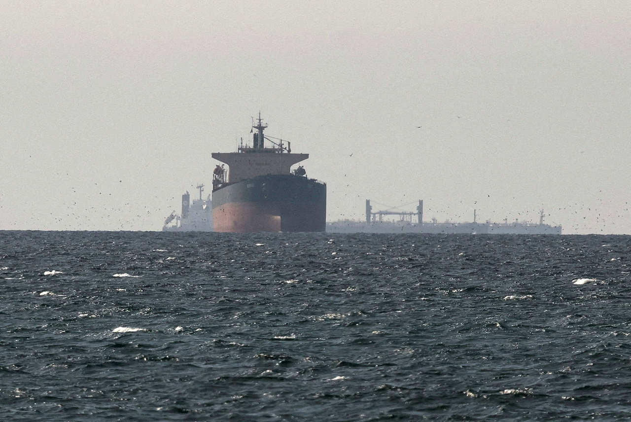 Cargo ships in the Gulf, near the Strait of Hormuz, as seen from northern Ras al-Khaimah, near the border with Oman's Musandam governance, amid the US-Israeli conflict with Iran, in United Arab Emirates, on March 11, 2026. (Reuters-Yonhap)