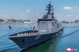 N. Korea's Kim unveils plans for 10,000-ton warships, nuclear navy