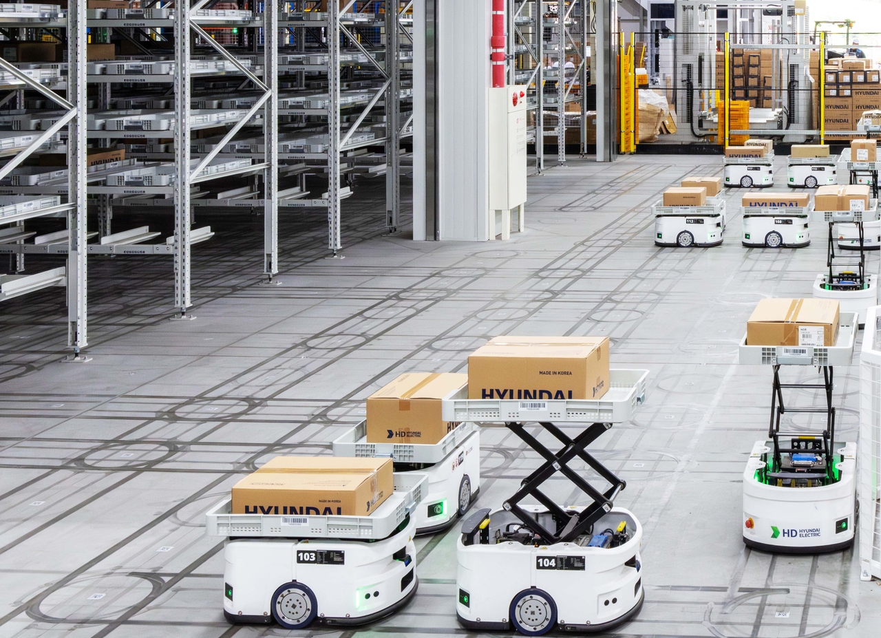 A logistics shuttle transports finished products and materials at HD Hyundai Electric's distribution campus. [HD Hyundai Electric]