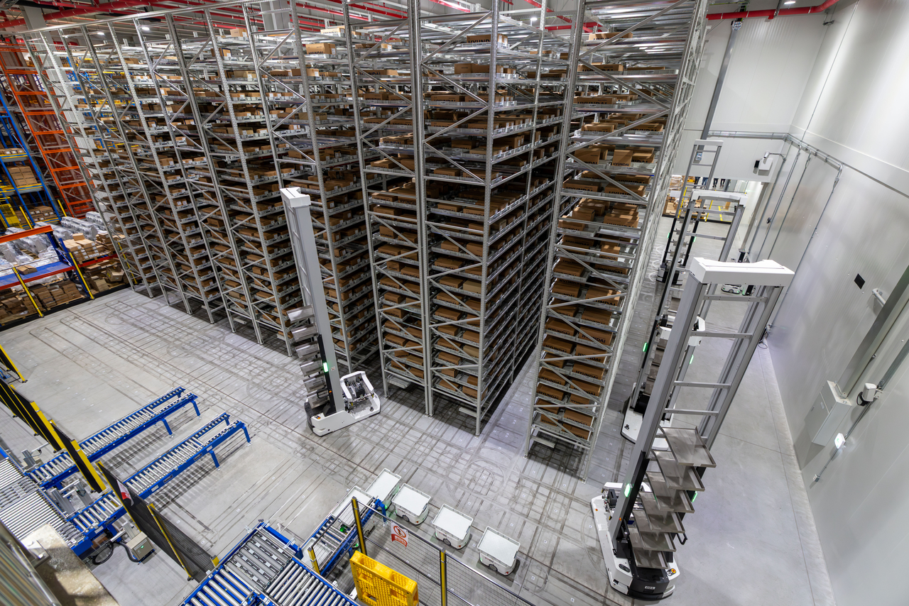 An automated case-handling robot stacks materials and finished products inside the warehouse at HD Hyundai Electric’s Cheongju Power Distribution Campus in North Chungcheong Province. (HD Hyundai Electric)