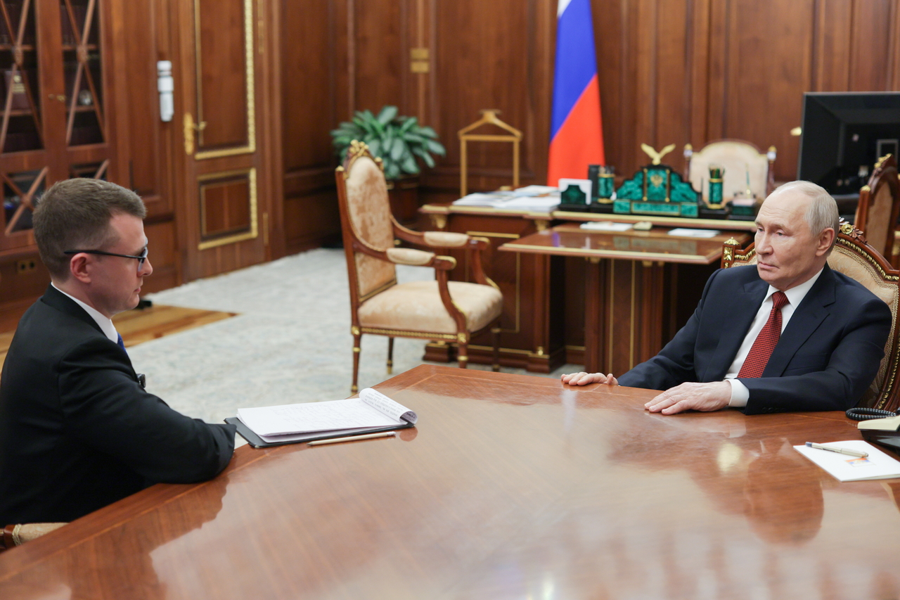 Russia's President Vladimir Putin (right) speaks during an interview in Moscow on Sunday. (Tass-Yonhap)
