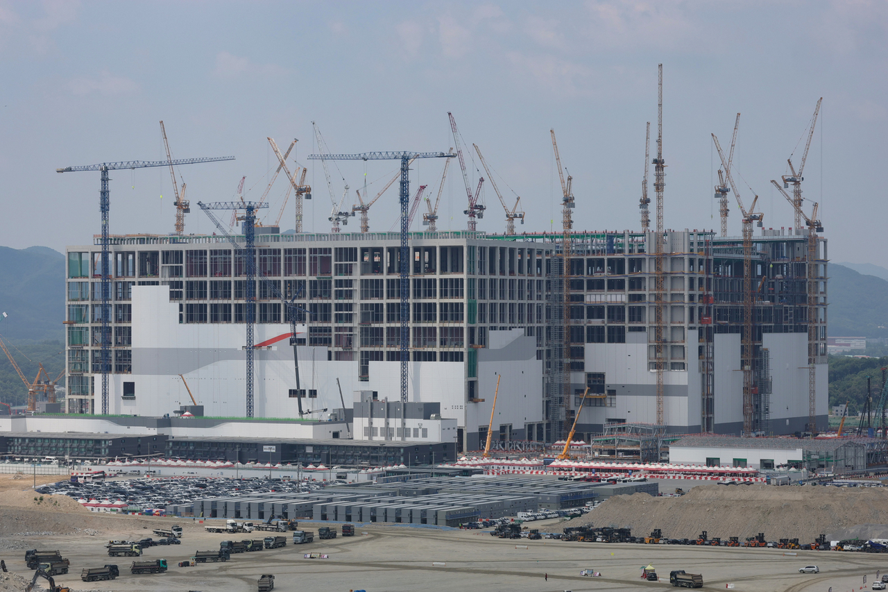 Construction continues on Monday at SK hynix's semiconductor cluster in Yongin, just south of Seoul, where the existing hub is running short of space and power. (Yonhap)