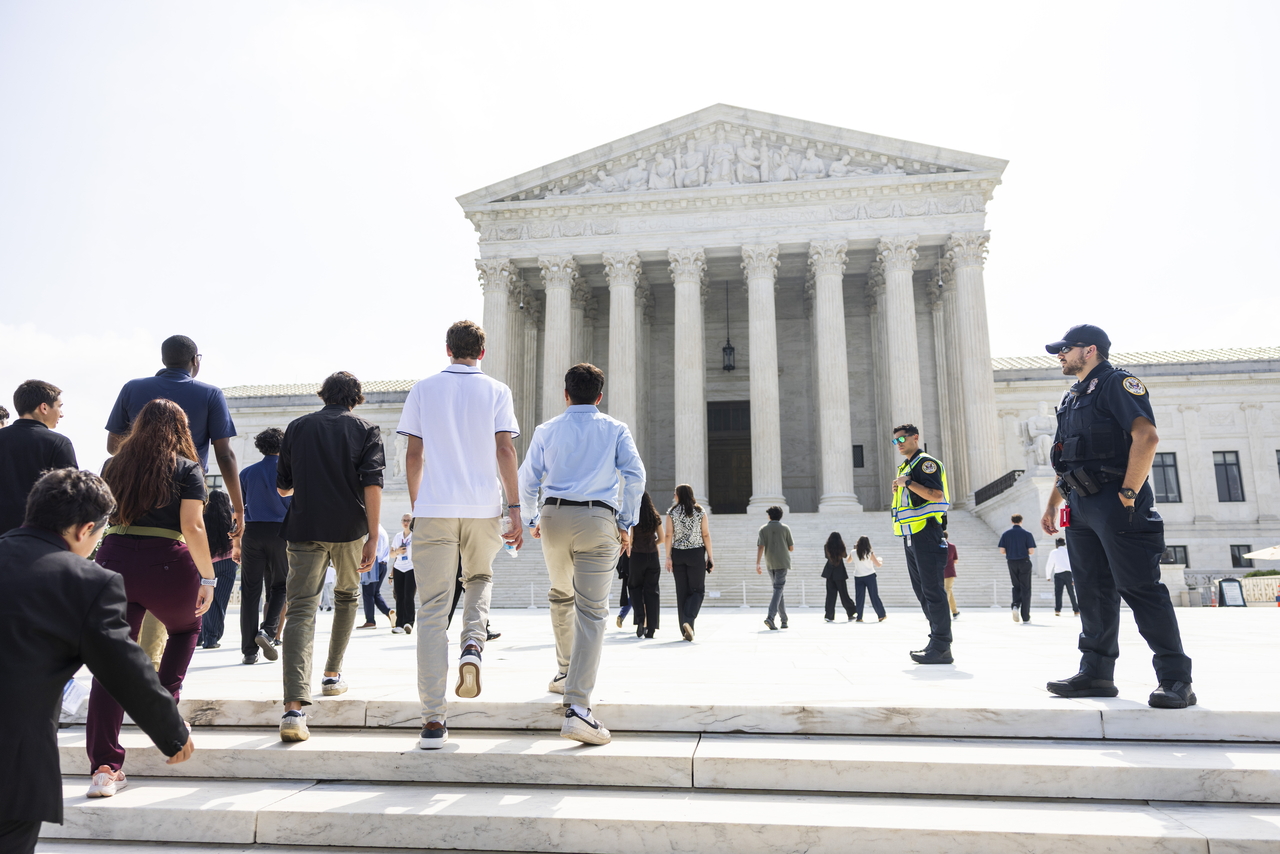 Visitors walk outside the US Supreme Court as it prepares to release decisions in multiple cases in Washington on Monday. (EPA-Yonhap)