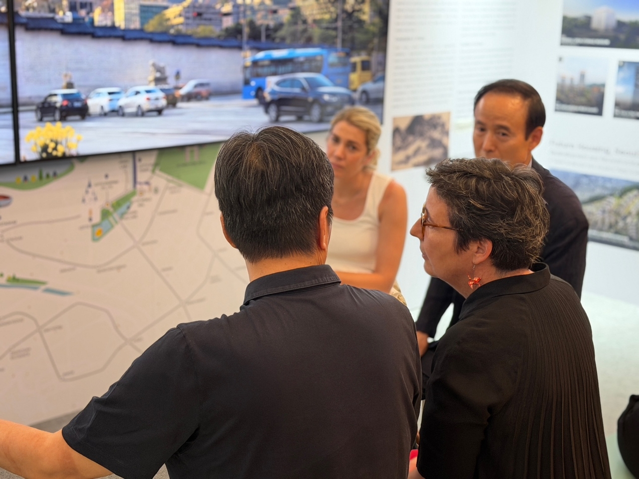 Participants converse at an exhibition pavilion on Seoul architecture during the 2026 UIA World Congress of Architects in Barcelona, Spain, Monday. (Seoul Metropolitan Government)
