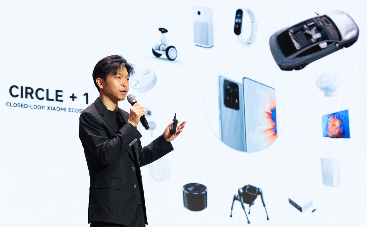 Li Tianyuan, general manager of industrial design and chief designer at Xiaomi Auto and vice chairman of Xiaomi Group's design committee, delivers a presentation titled "The Car That Thinks" at the Future AI Mobility Summit at the Korea Chamber of Commerce and Industry in Seoul on Tuesday. (Yoon Chang-bin/The Korea Herald)
