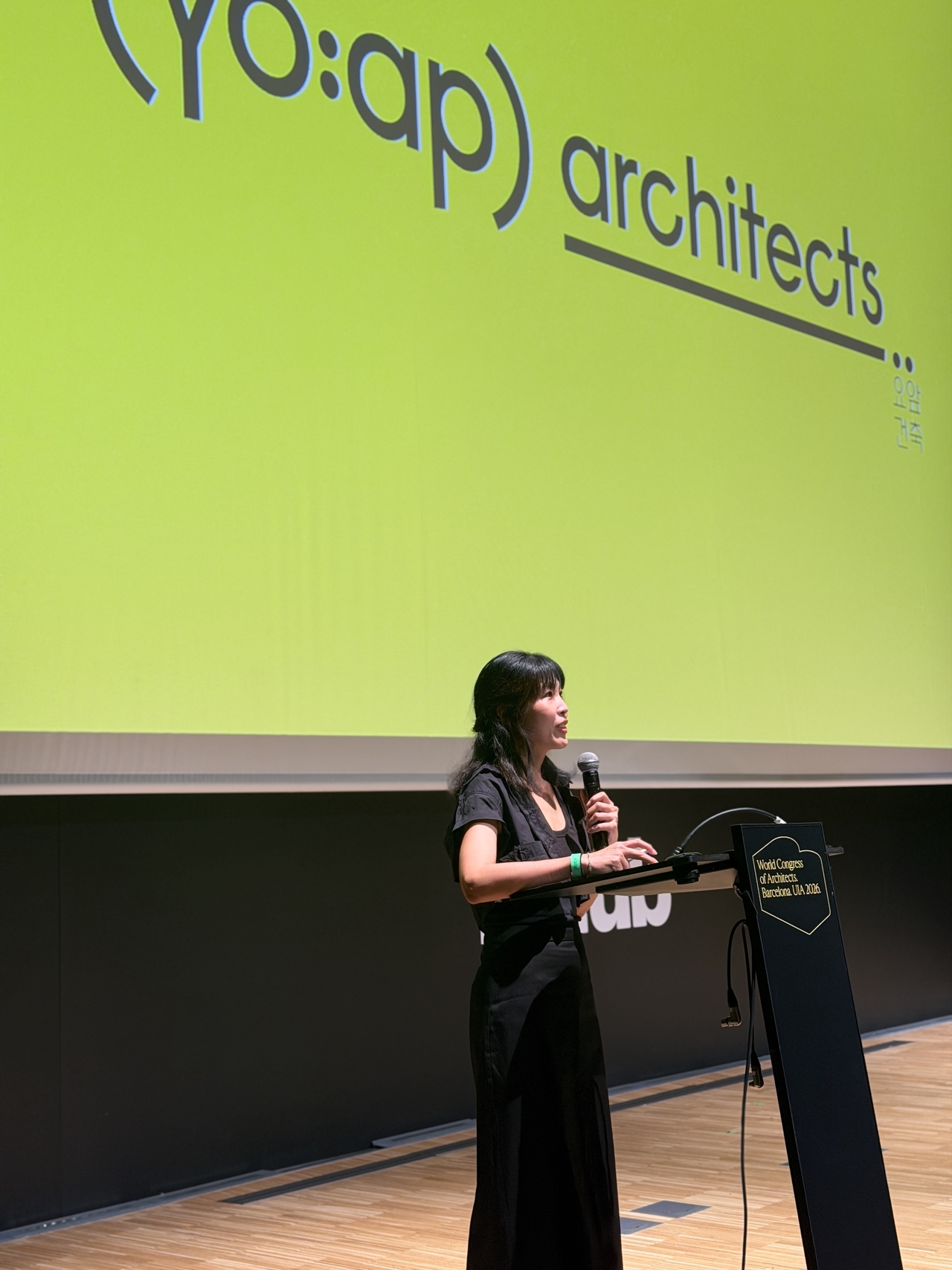 Kim Do-ran, one of the founding partners of Yoap Architects, speaks at an open session at the 2026 UIA World Congress of Architects in Barcelona, Spain, Monday. (Seoul Metropolitan Government)