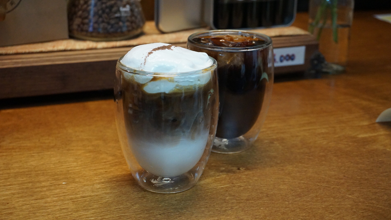 A cup of cream coffee (left) and an Americano at Eunma Coffee, located in Eunma Apartment Complex in Seoul (Cha Min-jung/The Korea Herald)